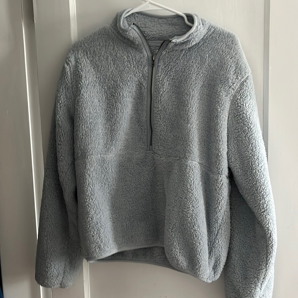 Fuzzy light blue quarter zip. Looks grey in pics but it’s light blue!
